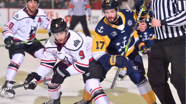 Adirondack's Tristen Ashbrook tussles with Norfolk's Austin Keating during Game 2 on Saturday night in Glens Falls, New York. (Andy Camp photos)