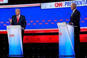 President Joe Biden and Republican presidential candidate former President Donald Trump are shown on stage during a presidential debate.