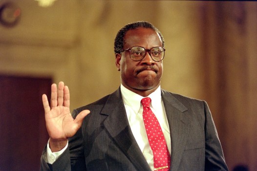 US Supreme Court nominee Clarence Thomas raises his right hand as he is sworn in