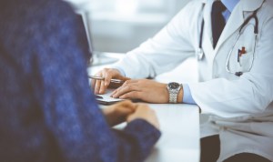 A patient discusses medical issues with a doctor