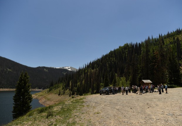 A group stands along the bank of Platoro Reservoir during the Water Education Colorado 2018 Rio Grande River Basin tour on June 10, 2018. (Photo by RJ Sangosti/The Denver Post)