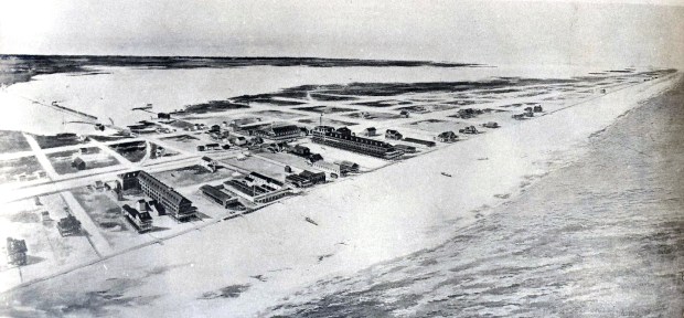 Simulating an aerial view if facing northwest, an 1895 rendering from the Baltimore, Chesapeake & Atlantic Railway shows early development in Ocean City between the Atlantic Ocean and Sinepuxent Bay. The railroad bridge in the upper left of the frame was destroyed in the 1933 storm that created the Ocean City inlet.