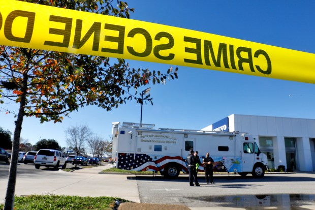 File photo, Hampton Police officers investigate a shooting that involved a police officer in the 1000 block of West Mercury Boulevard in Hampton Tuesday January 4, 2022. (Jonathon Gruenke / Daily Press)