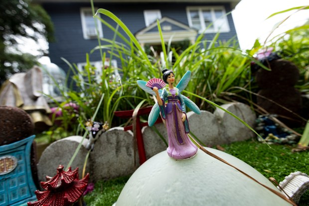 A fairy is seen in front of the Fairy Tree in Norfolk, Virginia, on July 26, 2024. (Billy Schuerman / The Virginian-Pilot)