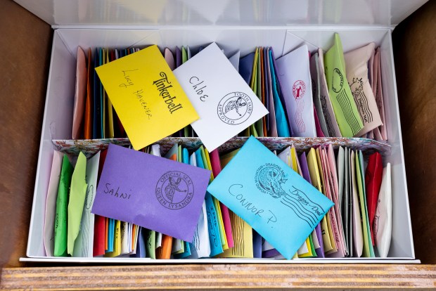 Letters are displayed in the return box for the Fairy Tree in Norfolk, Virginia, on July 26, 2024. Children can write letters to fairies and have a response in a few days. (Billy Schuerman / The Virginian-Pilot)