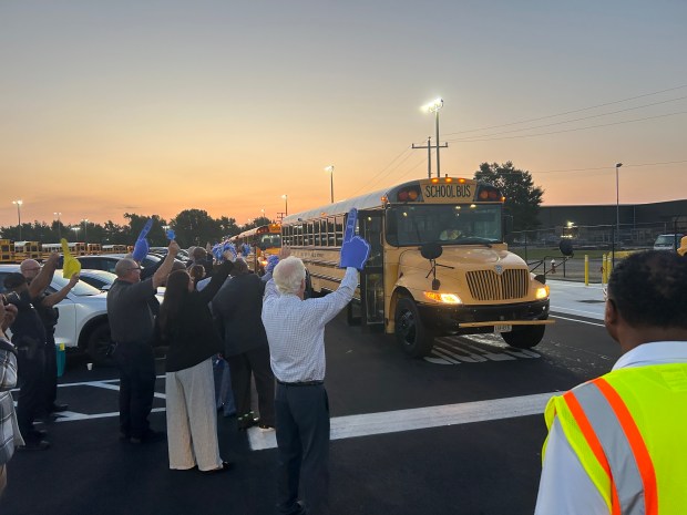 Hampton school and city leaders cheer on bus drivers as they leave the lot to pick-up students on the first day of school, Monday, Aug. 26, 2024. (Nour Habib/The Virginian-Pilot and Daily Press)