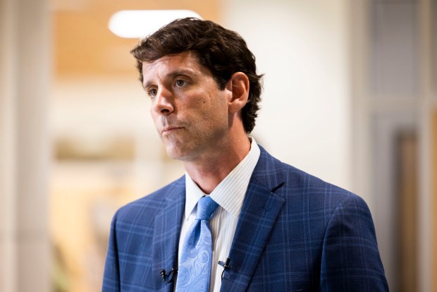 Dan Peterson, chair of the nonprofit that owns the exhibits at the Virginia Aquarium, speaks with members of the local press after addressing city council at Virginia Beach City Hall on Tuesday, Aug. 27, 2024. (Kendall Warner / The Virginian-Pilot)