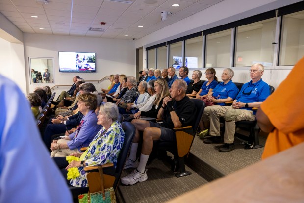 Multiple members of the aquarium foundation and volunteers fill the audience as Dan Peterson, chair of the nonprofit that owns the exhibits at the Virginia Aquarium, addresses city council at Virginia Beach City Hall on Tuesday, Aug. 27, 2024. (Kendall Warner / The Virginian-Pilot)