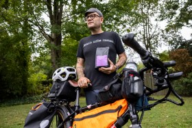 "I wanted to do something big, but I wanted to do it in a way where I could give back," Heath Scott said of a plan to mark his 50th birthday by biking across the state and raising money for the poor.