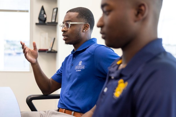 Elie Bracy IV speaks during an interview in his father's, superintendent Elie Bracy III, office at Portsmouth City Hall on Wednesday, Aug. 14, 2024. Elie will begin soon enter his second year as a preschool special education teacher in Portsmouth City Schools. (Kendall Warner / The Virginian-Pilot)