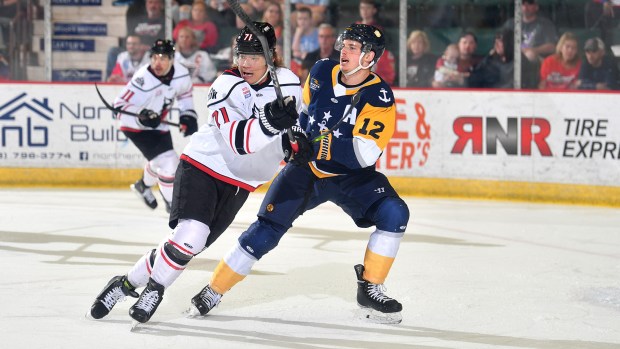 Norfolk Admirals forward Danny Katic, right, and Adirondack Thunder forward Yushiroh Hirano battle for position during Game 6 of the ECHL North Division finals on Tuesday night in Glens Falls, New York. (Courtesy of Andy Camp)