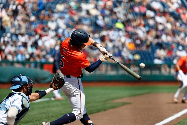 Virginia shortstop Griff O'Ferrall connects on a pitch during Friday's College World Series game against North Carolina. O'Ferrall went 0 for 2 with an RBI on a sacrifice fly and a walk. (Courtesy of UVA)