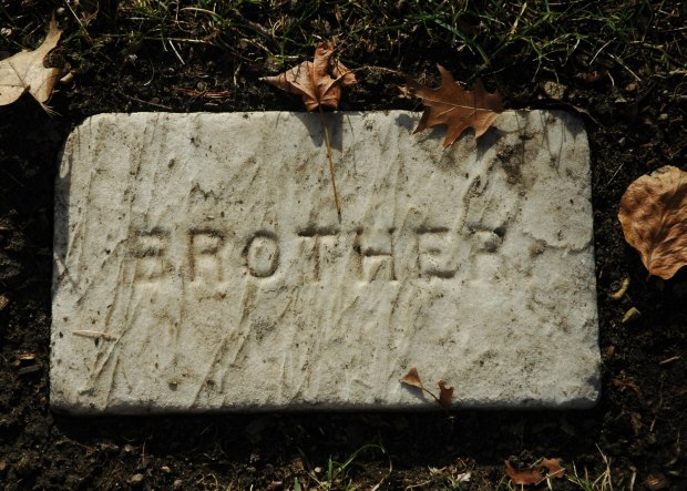 Gravestone of John S. Jacobs: says only "BROTHER."