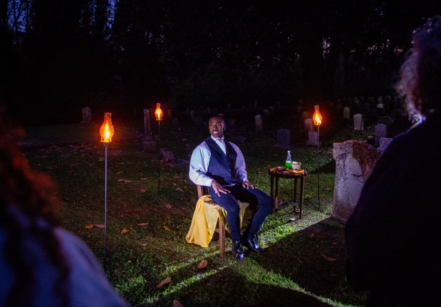 Kelstin Holmes, a junior at the Mississippi School for Mathematics and Science, explores some of the racial tensions after the Civil War in "Tales From the Crypt," in Friendship Cemetery in Columbus, Miss., on April 3, 2024. Each spring, Columbus, Miss., has opened its Civil War-era homes to visitors. Some say the event should reflect more the oppression behind the architecture, and how the city has changed since. (Kate Medley/The New York Times)