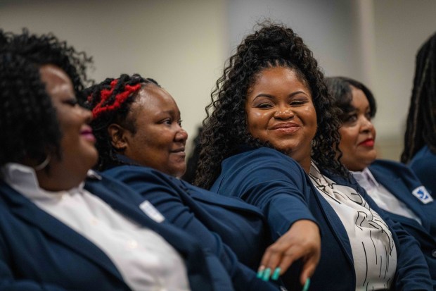 Bristeria Clark (center), a nursing student who also works full-time in county government, is a member of Morehouse School of Medicine's first class of rural doulas, called Perinatal Patient Navigators. (Matthew Pearson/WABE/TNS)